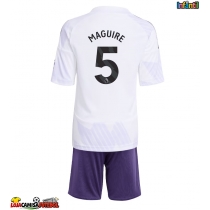 Camisa de Futebol Manchester United Harry Maguire #5 Equipamento Secundário Infantil 2025-26 Manga Curta (+ Calças curtas)